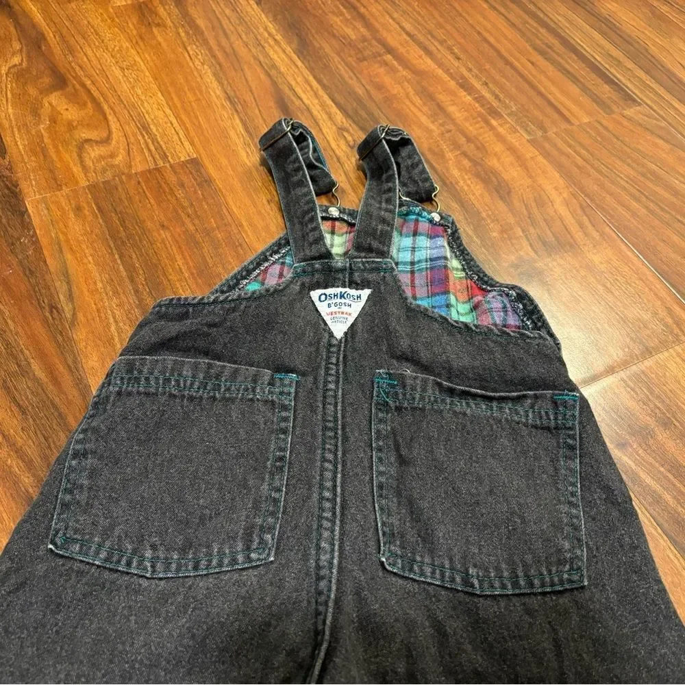 Osh Kosh B’Gosh Vintage black denim overalls with plaid accents.